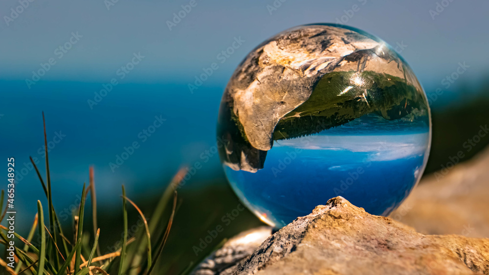 Crystal ball alpine landscape shot on a rock at the famous Kampenwand, Aschau, Chiemgau, Bavaria, Germany Crystal ball alpine landscape shot on a rock at the famous Kampenwand, Aschau, Chiemgau, Bavaria, Germany