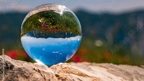 Photography Crystal ball alpine landscape shot on a rock at the famous Loser summit, Steierm