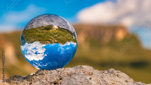 Crystal ball alpine landscape shot on a rock at the famous Grossglockner High Alpine Road, Salzburg, Kaernten, Austria