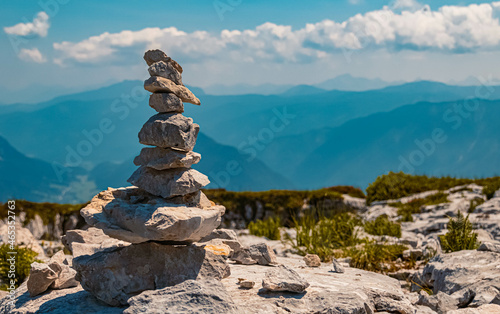 Beautiful alpine summer view with a cairn and mountains in the background at the famous Loser summit, Altaussee, Steiermark, Austria photo