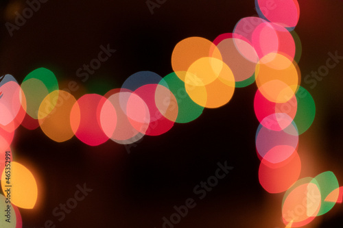 Large colorful bokeh circles on a dark background