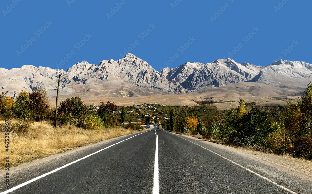 Fototapeta premium A western view of the village Cukurbag and the Aladaglar Mts from the state road 51.02 in Nide province of Turkey