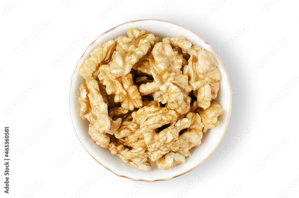 Peeled walnut kernels in a bowl. Isolated on a white background. Nuts contain vegetable protein and vitamins. For a healthy and vegetarian diet Peeled walnut kernels in a bowl. Isolated on a white background. Nuts contain vegetable protein and vitamins. For a healthy and vegetarian diet