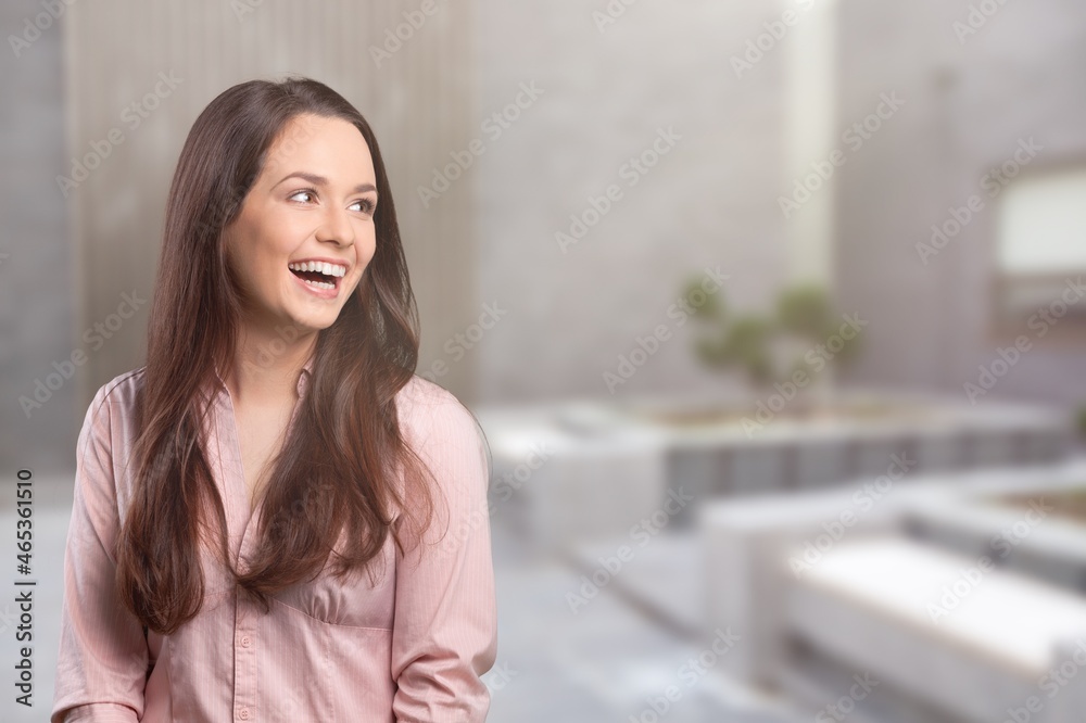 Portrait of a cheerful, adult girl laughing stand on a background Portrait of a cheerful, adult girl laughing stand on a background