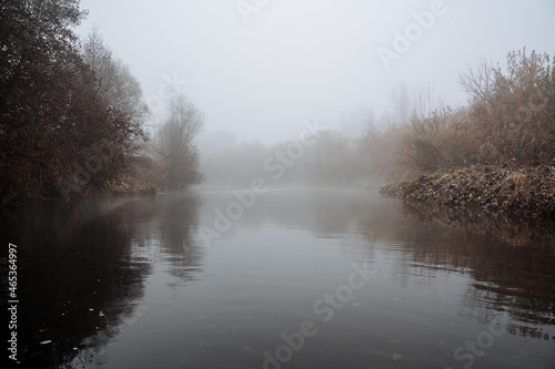 Fog on the river. Tranquility and silence on the water surface. Autumn in the Urals, Bashkortostan, Russia.