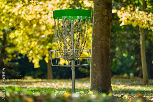 Disc golf basket in autumn sun