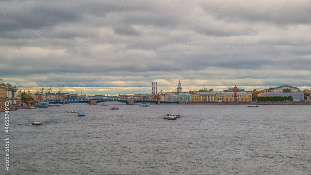 River landscape with boats and ancient buildings on the embankment of Neva, a river flows through the city of Sankt-Petersburg River landscape with boats and ancient buildings on the embankment of Neva, a river flows through the city of Sankt-Petersburg