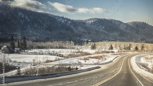 Asphalt road in winter with a mountain view