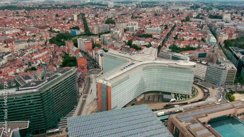 Headquarters of the EU Commission Berlaymont in European Quarter. Establishing Aerial View of Brussels Downtown with Political Landmarks - Office buildings in Bruxelles, Belgium. 4K drone zoom in shot photo