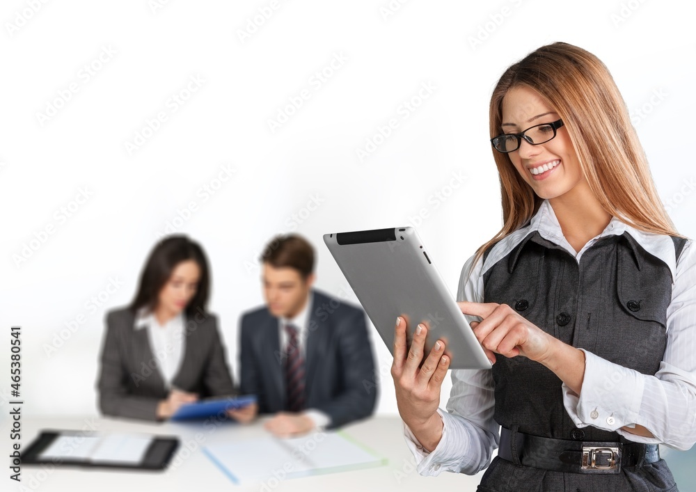 Programmers cooperating at IT company developing apps on office background Programmers cooperating at IT company developing apps on office background