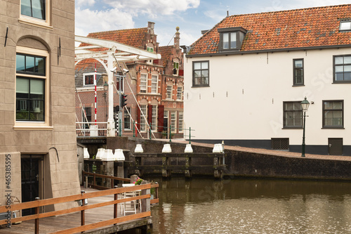 White drawbridge in the center of the picturesque town of Oudewater. photo