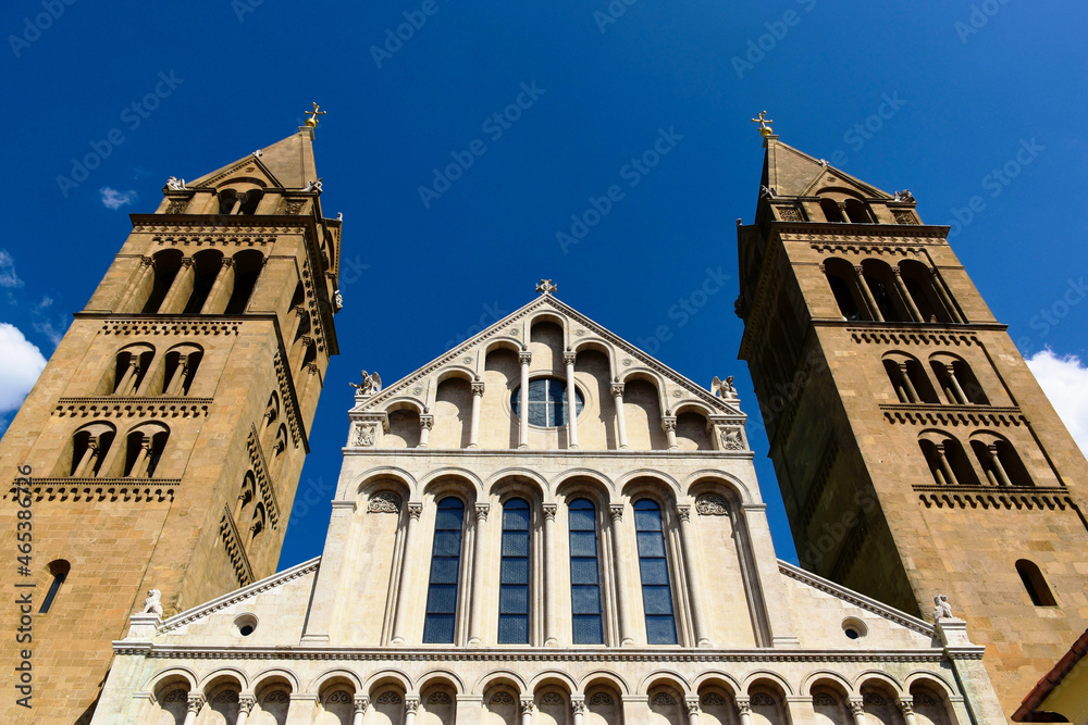 Cathedral in the town of Pecs in Hungary. a roman catholic church building. neo romanesque style. diminishing perspective. bright summer light, travel and tourism concept. arched windows. bell towers