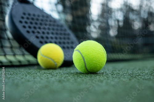 Paddle tennis rackets and balls on artificial grass © FotoAndalucia