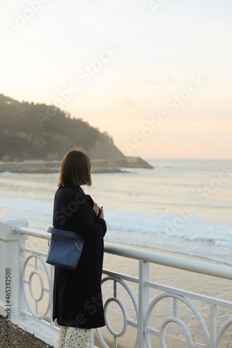 girl looking at the ocean © Ainhoa