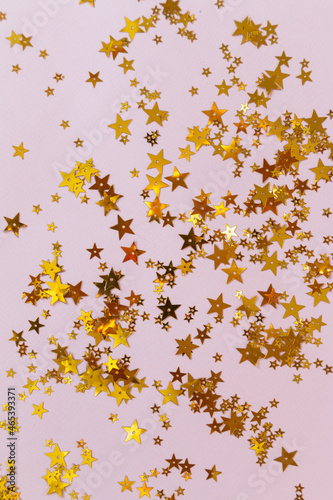 golden stars on pink background, greeting card template with empty space for text 