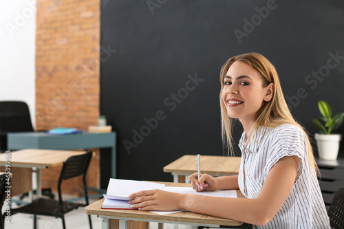 Student passing exam at school