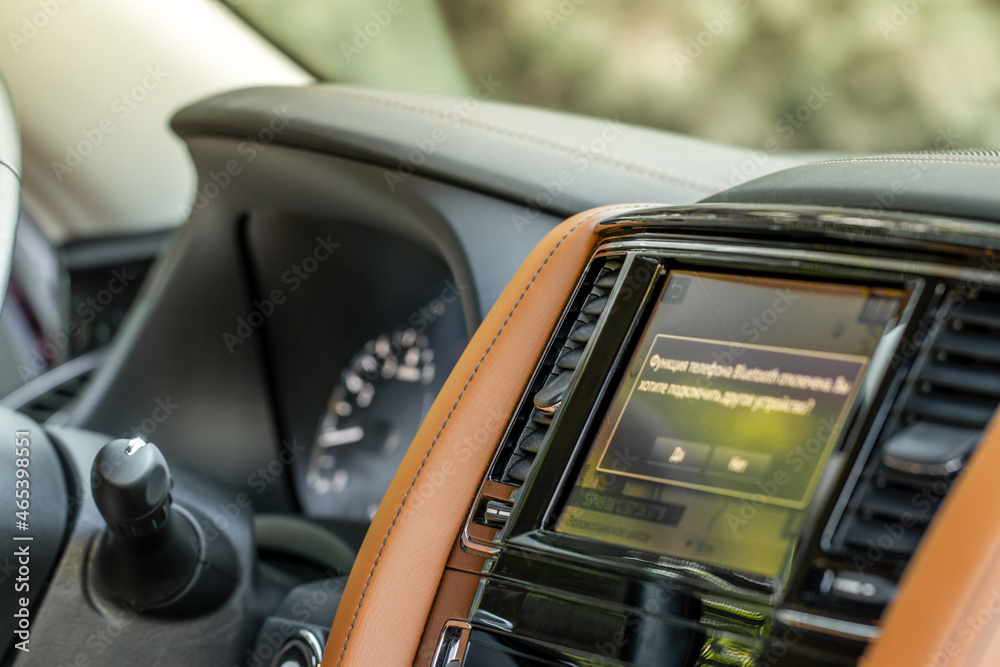 Obraz premium Modern car media display in the interior of the car. Touchscreen monitor on the dashboard of the modern car.