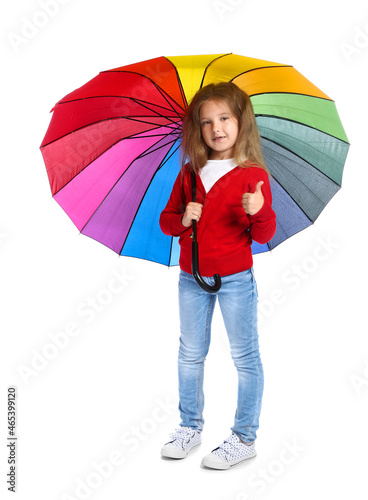 Pretty little girl with umbrella showing thumb-up on white background