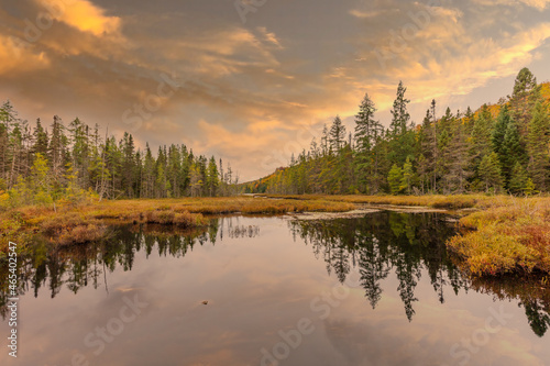 Lac St Michel in Autumn showing fall colors in cottage country, Quebec Canada.