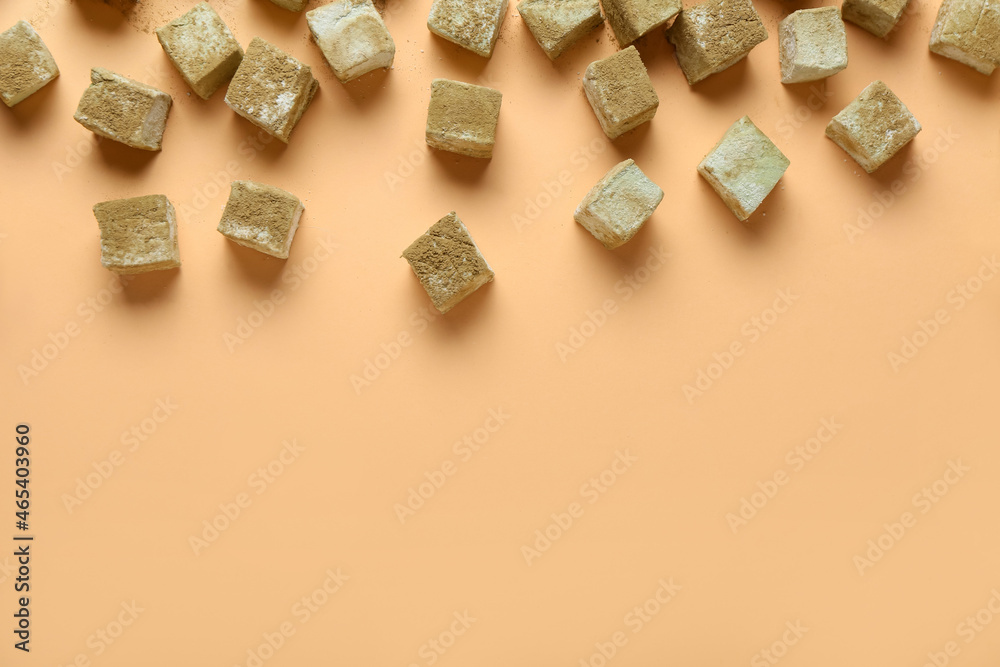 Tasty hojicha marshmallows on color background Tasty hojicha marshmallows on color background