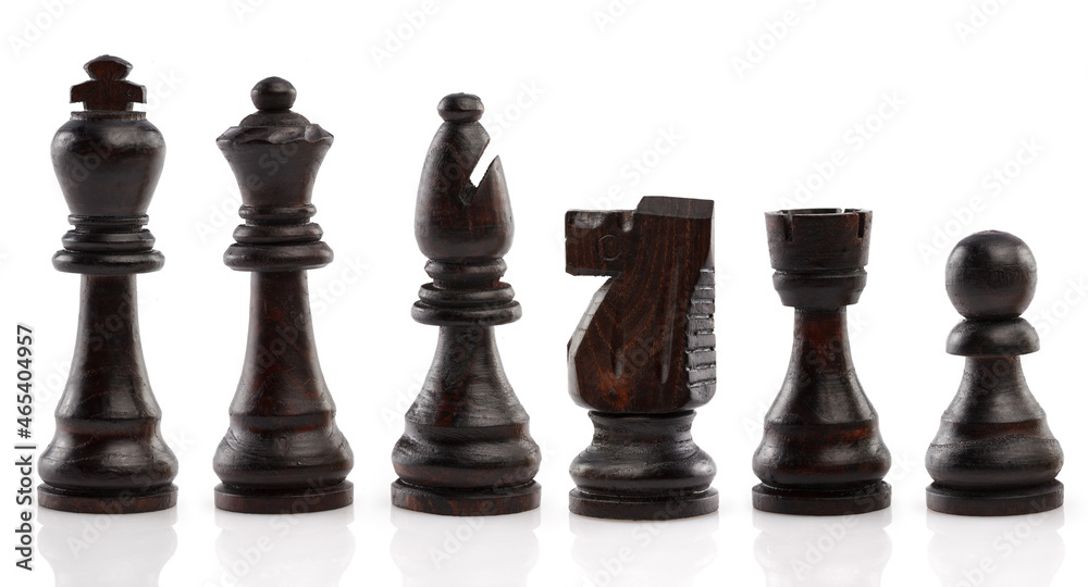 Black chess, standing in a row, isolated on white background. Close-up. Black chess, standing in a row, isolated on white background. Close-up.
