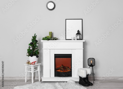 Interior of room with fireplace and Christmas decorations