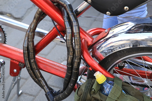 bicycle chain adn lock on red frame