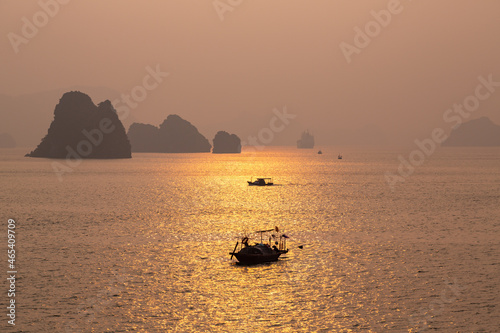 Golden Sunrise on HaLong Bay, Fishing Boats in Silhouette and Limestone Islands on the Horizon