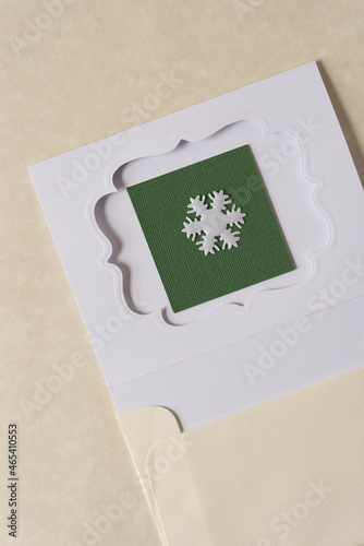 die cut paper card with fancy window opening and fabric snowflake