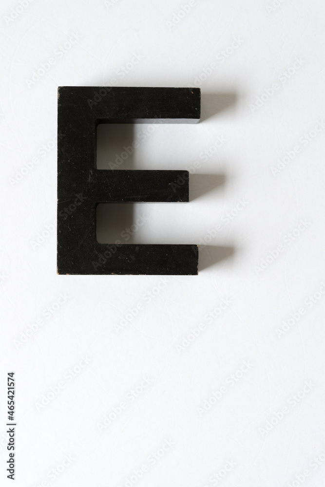 grungy letter block E on white grungy letter block E on white