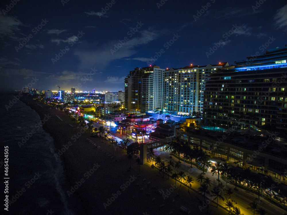 epic drone shot of las olas beach city skyline showing large buildings and lights