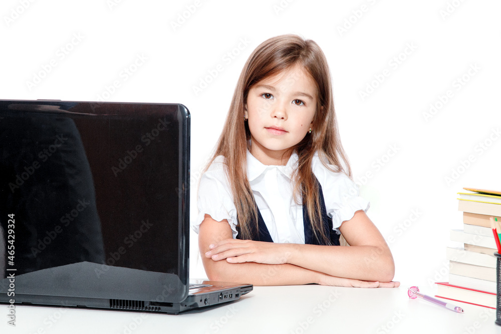 Happy and cute teen school girl sitting on laptop Happy and cute teen school girl sitting on laptop