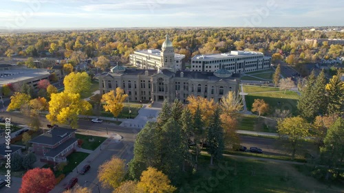 Aerial 4K footage of Wyoming State Capitol building in Cheyenne. Drone shot circling the statehouse at sunset in autumn. photo