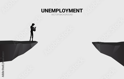silhouette of losing job man walking to the cliff. Concept for depression of unemployment people.