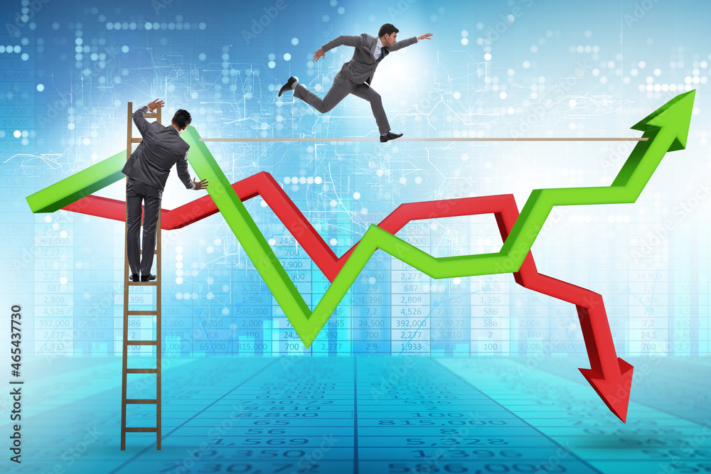 Businessman balancing on tightrope on line chart Businessman balancing on tightrope on line chart