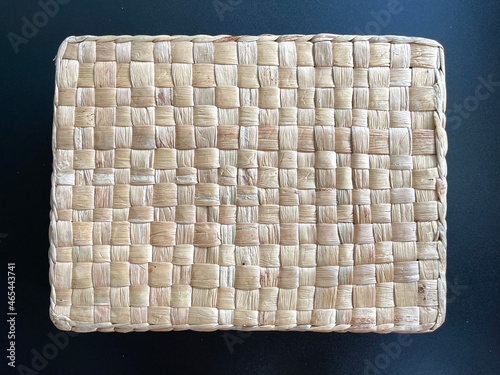 Handmade basket made from dried water hyacinth, woven basket for home use and decoration, weaved basket on black background 