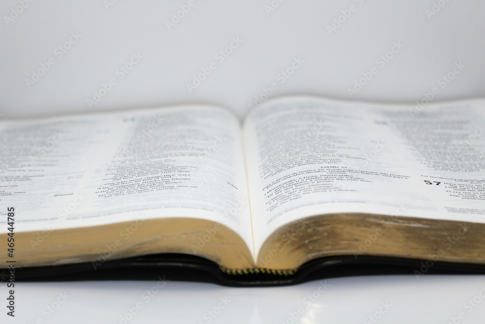 bible opened on a table white background bible opened on a table white background