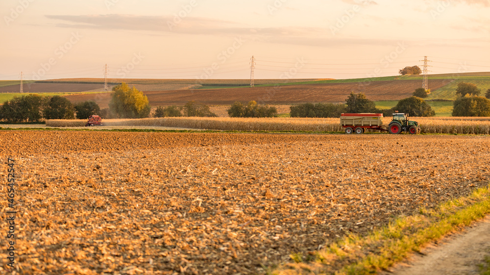 combine harvester working on a field in a french coutryside
