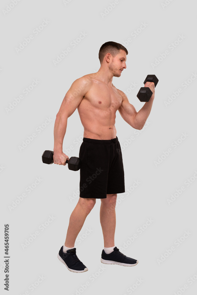 Man Topless Pumping Biceps with Dumbbell. Sprotsman Doing Traning on Biceps Muscles. Gym, Lifting Sport Concept. Man Topless Pumping Biceps with Dumbbell. Sprotsman Doing Traning on Biceps Muscles. Gym, Lifting Sport Concept.