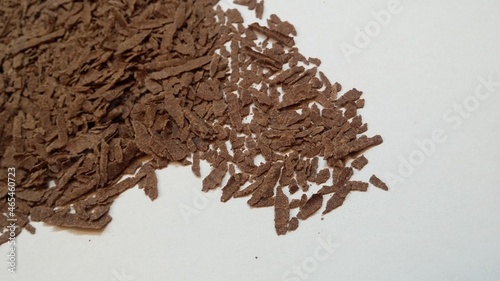 cacao nibs powder on white background
