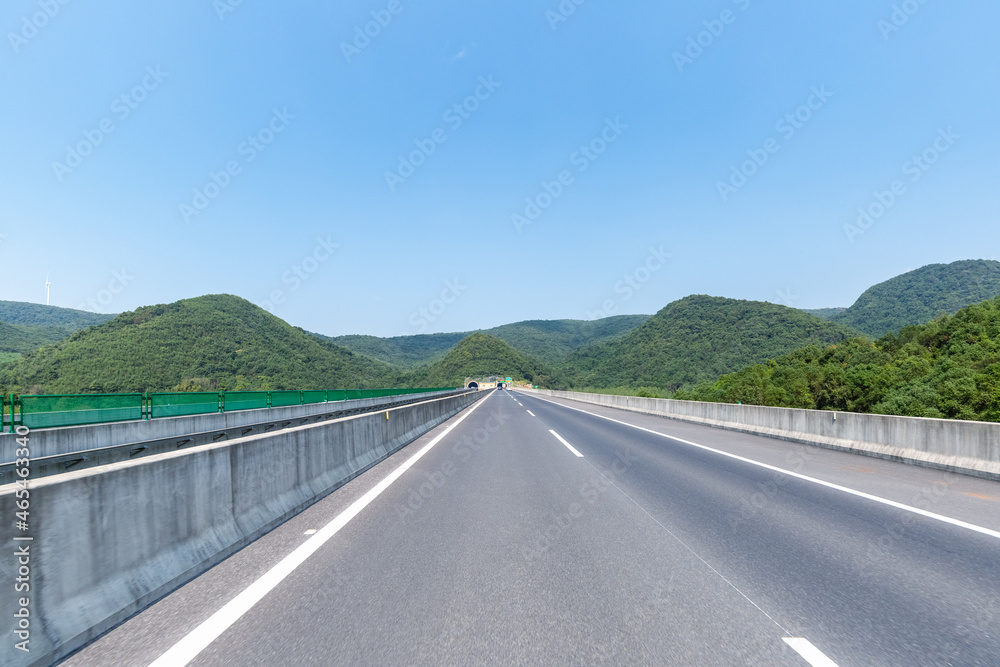 road leading into the tunnel