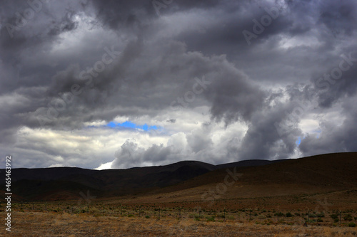 Dark Cloudy Sky over Desolate Hills