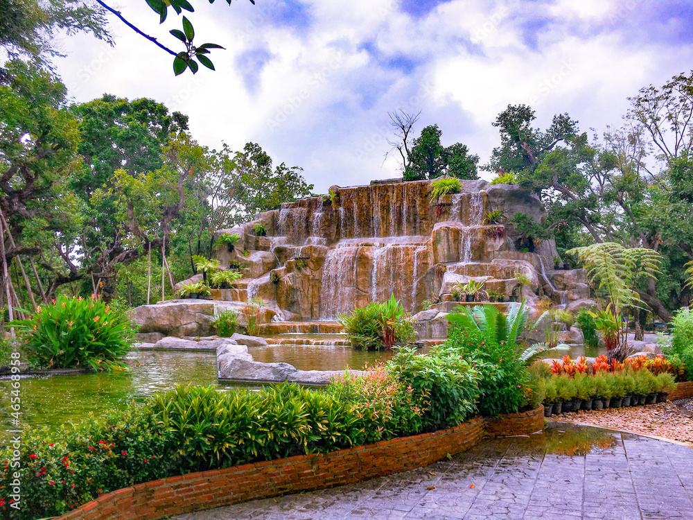 the picture of garden with waterfall.