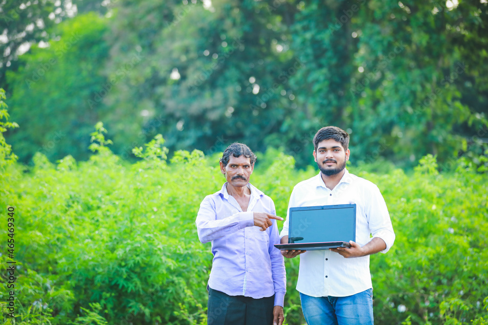 agronomist with farmer at cotton field agronomist with farmer at cotton field