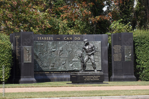 Arlington, Virginia, USA - October 25, 2021: SeaBees Memorial on Memorial Drive Near Arlington National Cemetery on a Fall Afternoon with Leaves Changing Colors in the Background photo