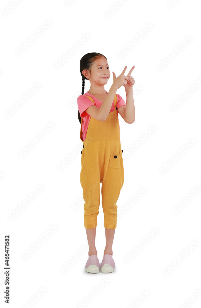 Asian little girl child pointing two forefinger up over white background. Image with Clipping path. Asian little girl child pointing two forefinger up over white background. Image with Clipping path.