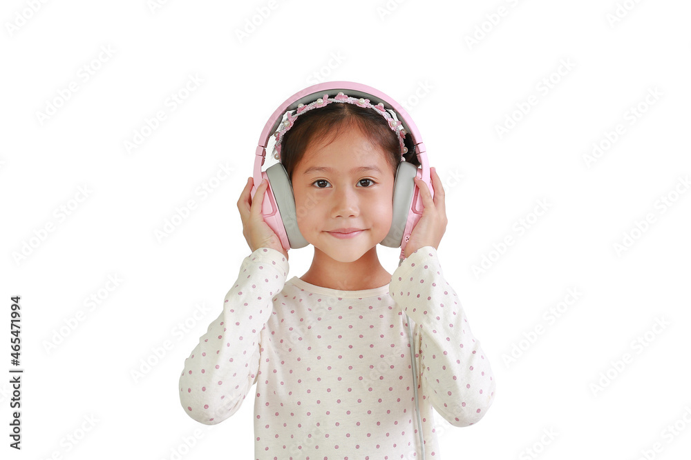 Cute Asian little girl child enjoying with headphones listening to music and look straight at camera isolated on white background. Cute Asian little girl child enjoying with headphones listening to music and look straight at camera isolated on white background.