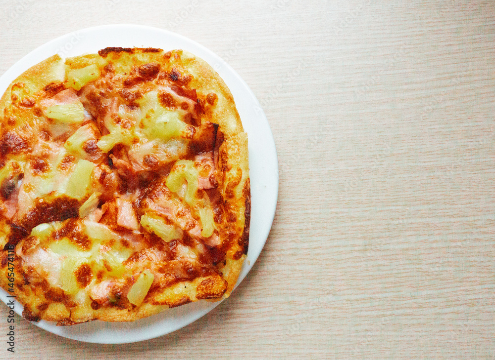 Close up of Pizza with pineapple, mozzarella cheese, ham, bacon, pizza sauce. Sliced Hawaiian pizza texture, Close up of Pizza with pineapple, mozzarella cheese, ham, bacon, pizza sauce. Sliced Hawaiian pizza texture,
