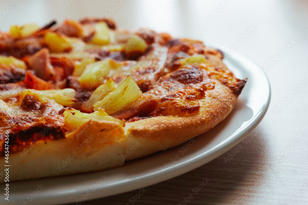 Close up of Pizza with pineapple, mozzarella cheese, ham, bacon, pizza sauce. Sliced Hawaiian pizza texture, Close up of Pizza with pineapple, mozzarella cheese, ham, bacon, pizza sauce. Sliced Hawaiian pizza texture,