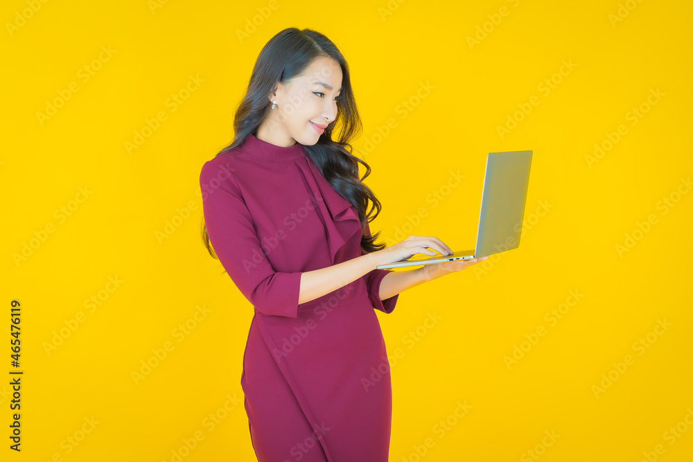 Portrait beautiful young asian woman smile with computer laptop